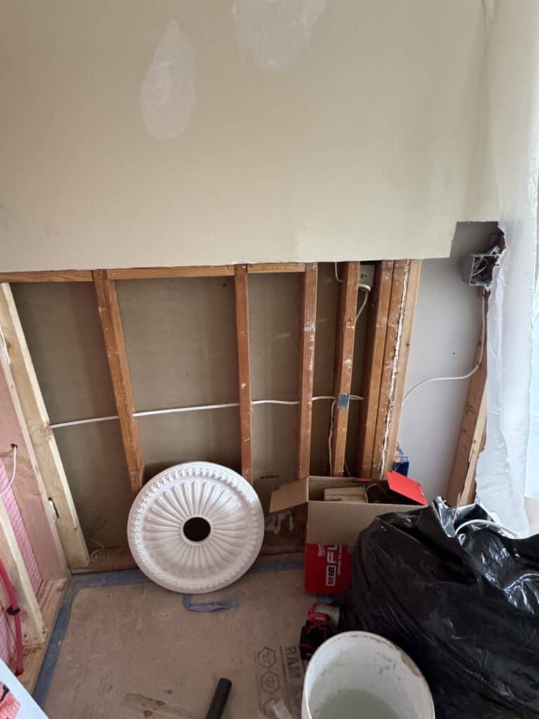 Interior of a home under renovation with wall sections removed.